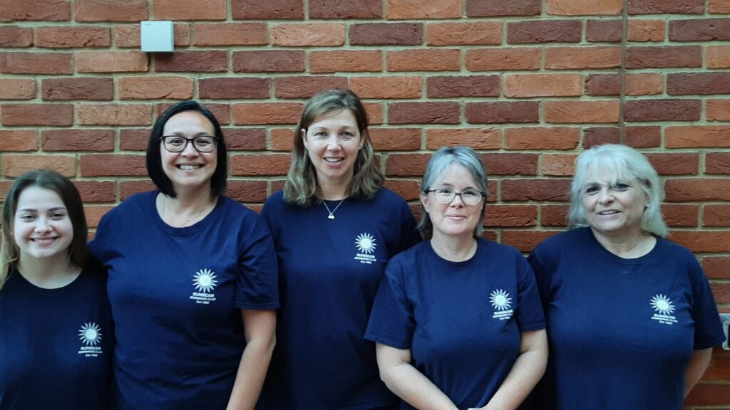 A photo of Hannah, Sabrina, Caroline, Grainne and Angela in their Sunbeam t-shirts